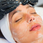 Woman receiving express facial treatment at Skinova Medspa in NYC to hydrate summer skin