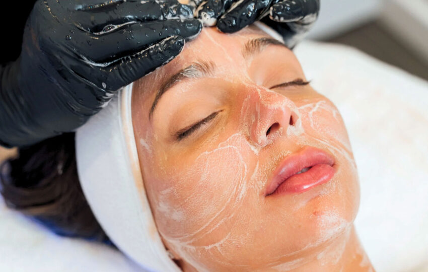 Woman receiving express facial treatment at Skinova Medspa in NYC to hydrate summer skin